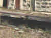 The platform was cantilevered out from the wall, I did not see any struts underneath it (I did not look too hard) there was also odd niches and air vent slots. Most of this area is now covered by earth pushed in.