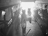 Three submarines in a dry dock.