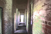 The central corridor in a temporary brick flight hut.