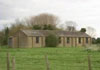 Temporary brick huts.