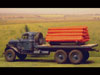 Fordson flat bed lorry carrying the gas cylinders.