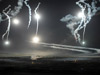 Night firing over the beach.