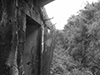 The view past an entrance door along a trench out of the bunker showing the gunners view from the embrasure.