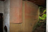 Way out with aerial slots on both sides of the door & also the camouflage still to be seen painted on the wall.