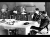 Galland and Osterkamp discussing battle tactics in the Officers Mess.