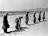 Laying mines on a beach.