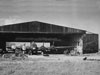 B17 under hangar repairs with the doors wide open.