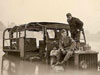 A Scammell gun tractor in the water with German soldiers sitting on it..