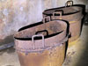 Two of the pots that fit into the cooker.