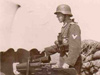 Gun commander with the binoculars.