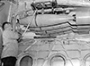 Bombs or depth charges were carried on two racks that were drawn inside the plane. When an attack was imminent, the bomb rack was drawn out to allow the bombs to be used..
