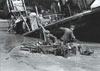 During the German retreat from France in August 1944 the river Seine represented a major barrier for the retreating troops. At Caudebec-en-Caux, the 50-ton steam ferry was sunk during a night attack on August 27 but was immediately replaced by a spare vessel. From August 15-30 the ferry carried across about 2,000 vehicles and thousands of men. In this picture a Schwimmwagen enter the water by the side of the sunken ferry.