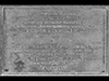 The plaque for Operation Aquitint on the sea wall at Les Moulins, Omaha Beach.
