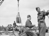 RAF Beach Party off loading bombs.