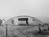 Over Blister hangar with bricked up ends at Alton Barnes post war.
