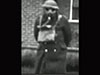 Soldier demonstrating his ant-gas kit..