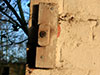 Part of a blackout curtain fixing. Blackout curtain was weather a heavy dark material or a shutter board painted black to stop light showing out of the windows at night.