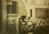 Wartime Nissen hut and cyclist.