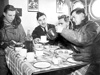 Crew sitting down to eat.