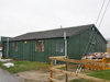 A Type hutting with an asbestos roof at RAF Honeybourne 2009. This is how the garage may have looked but with open doors each end.