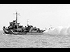 Destroyer laying a smoke screen.