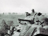 Possibly a Sherman shooting along the beach.