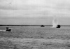 Landing craft under fire.