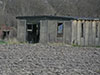 BFC hut. 
    British Concrete Federation and Nissen hut barracks.