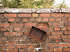 Fitting on the outer wall.