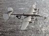 Liberator over the sea.
