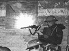 A soldier at a pillbox embrasure.