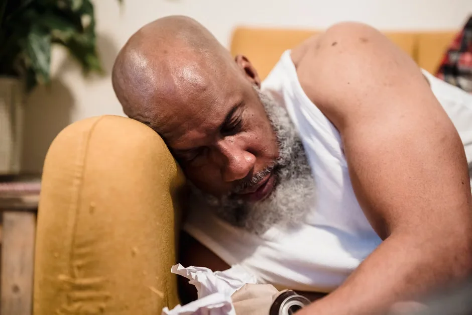 Man resting on couch