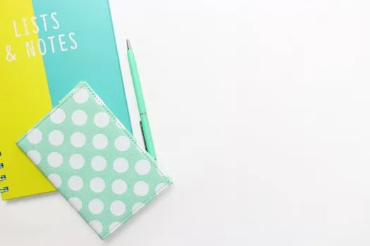 A note book & pen on a table