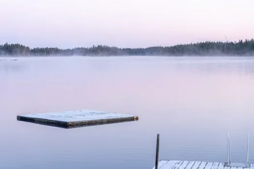 A raft floating on a still lake