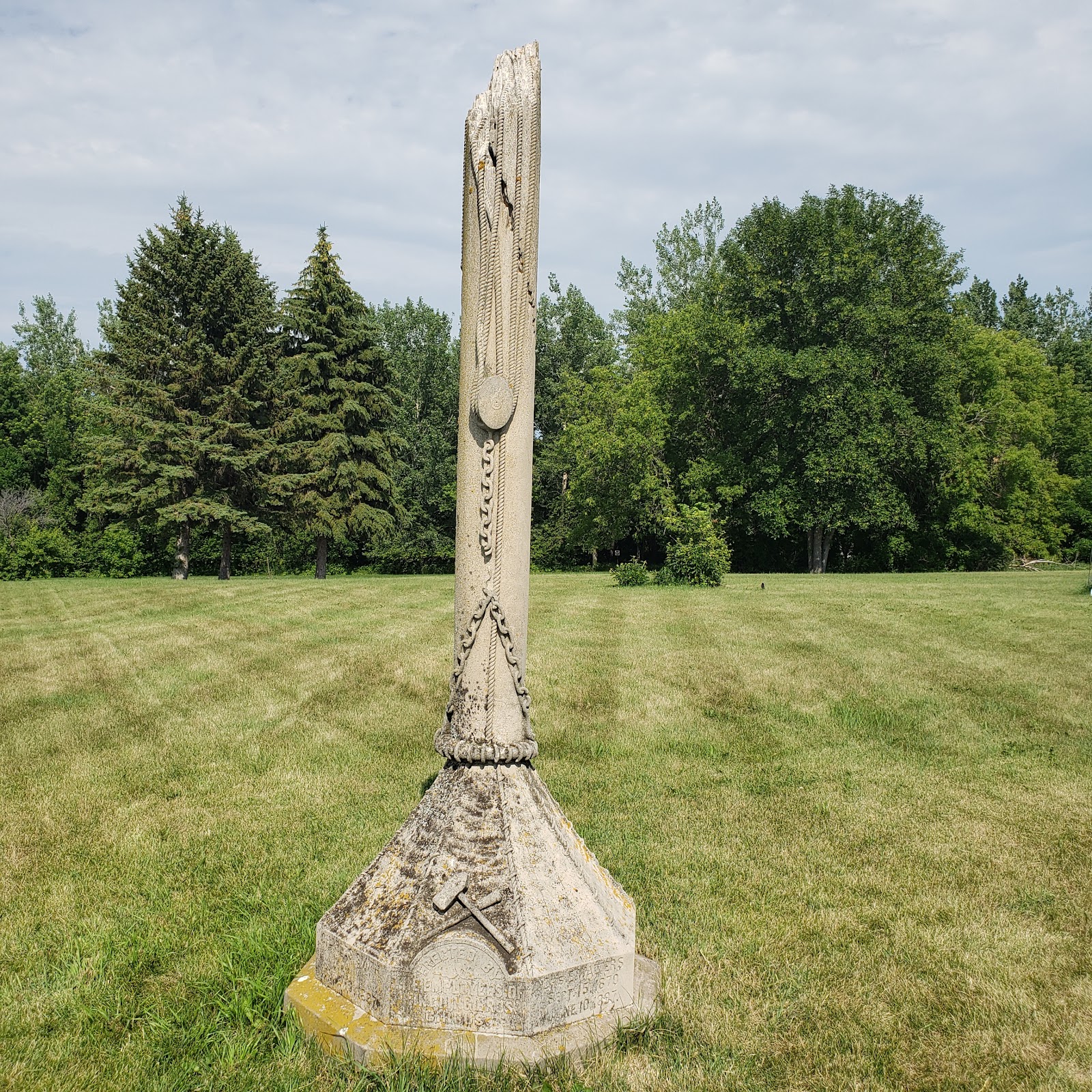 Tent Pole Monument to Circus Dead cemetery grounds and headstones