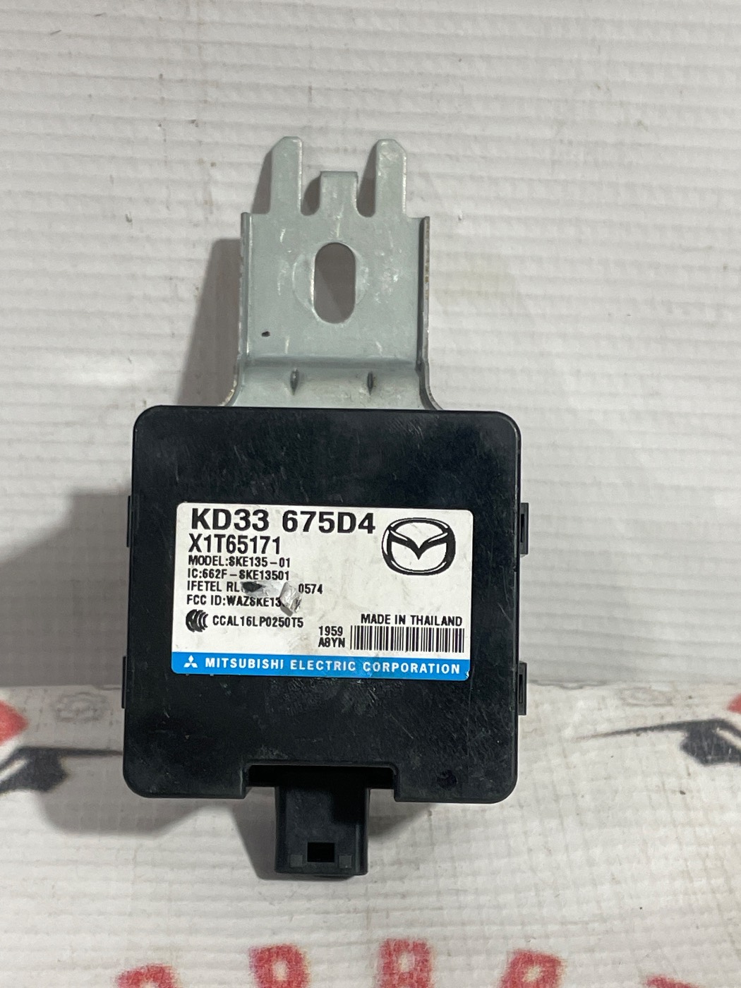 MODULO RECEPTOR DE LLAVE INTELIGENTE Y TPMS CENTRAL MAZDA CX5 13-21. Fotografía 1