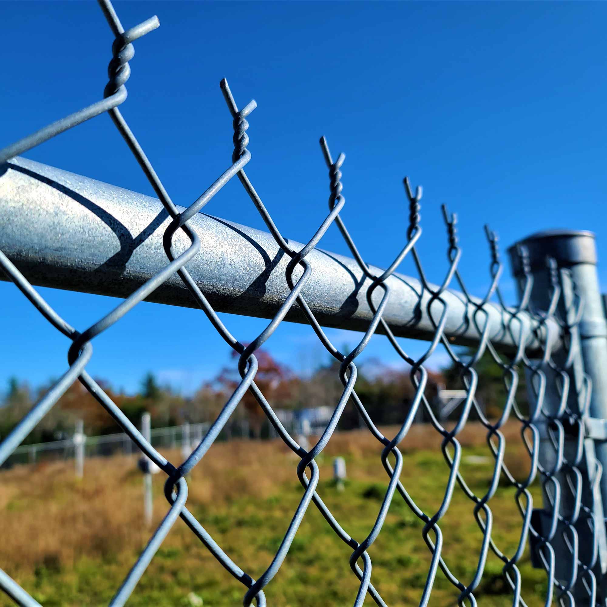 Chain link fence (galvanized, vinyl-coated, and privacy slatted in many colors)