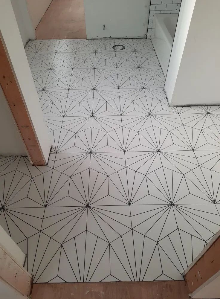 Slide 4 — "Tile it like a master with Romero Tile Master LLC!"