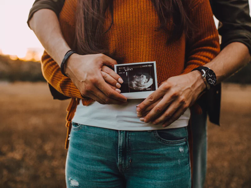 Excited parents in Titusville, FL, seeing their baby’s detailed 3D/4D and HDLive ultrasound image at Baby Fairytale, capturing joyful first glimpses and unforgettable bonding moments.