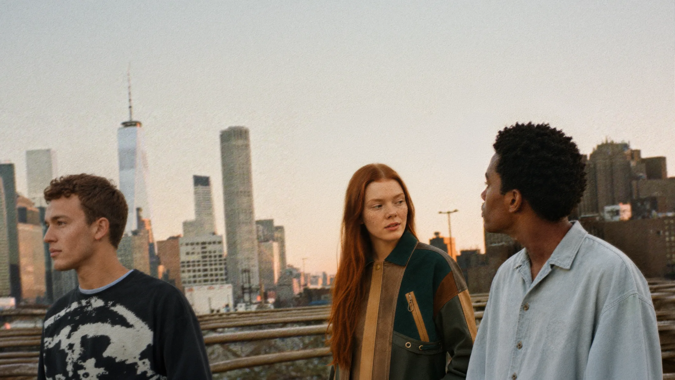 Digital models on a New York rooftop at dusk