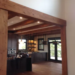 wooden arch entry into the renovated kitchen