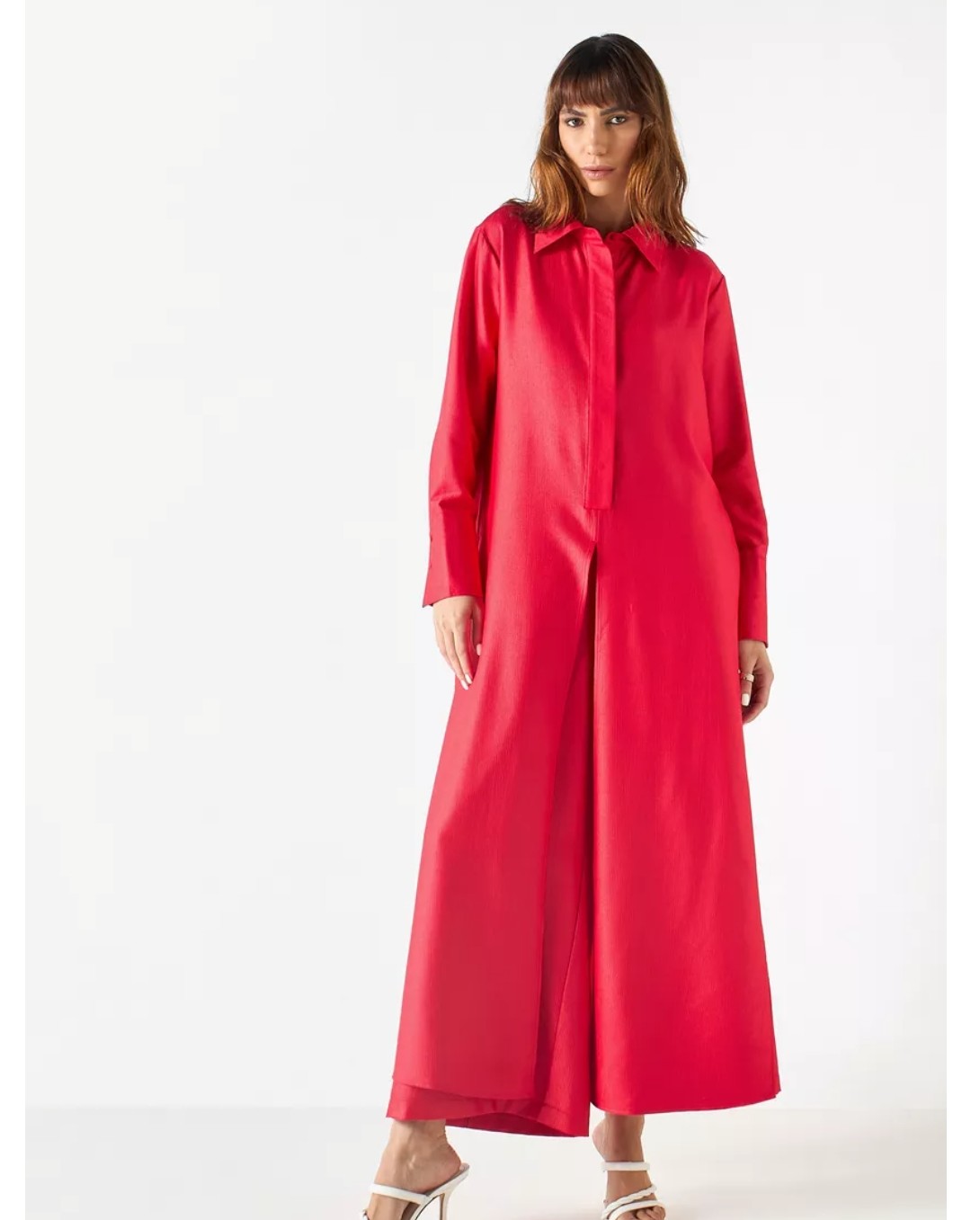 red textured wide legged pants with pockets and a longline shirt with slit details