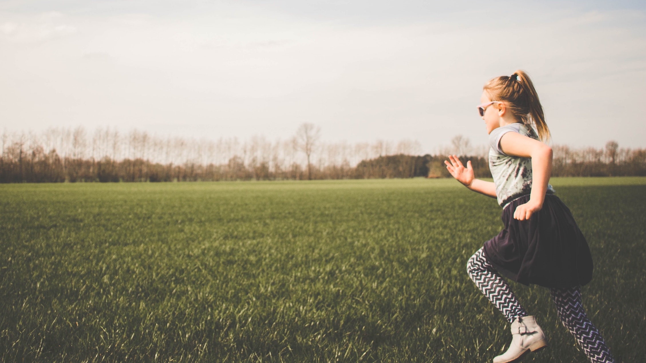 girl running across a field