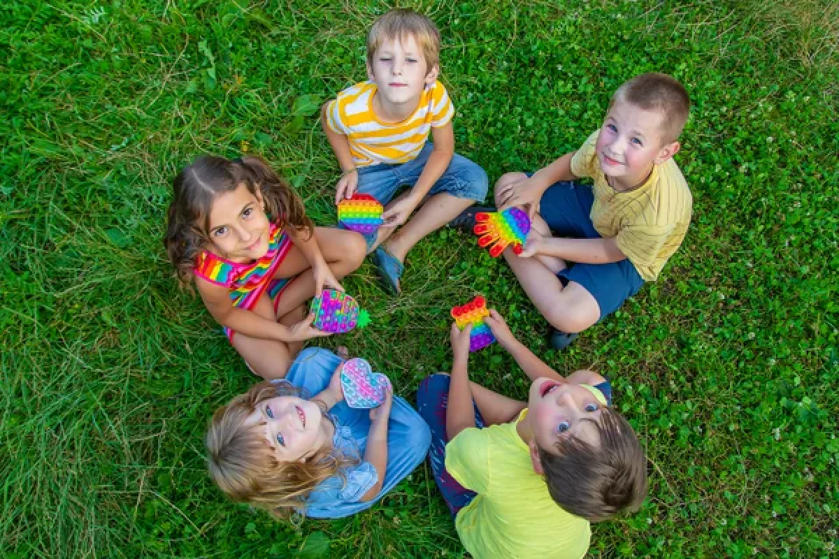 Kids sitting in grass