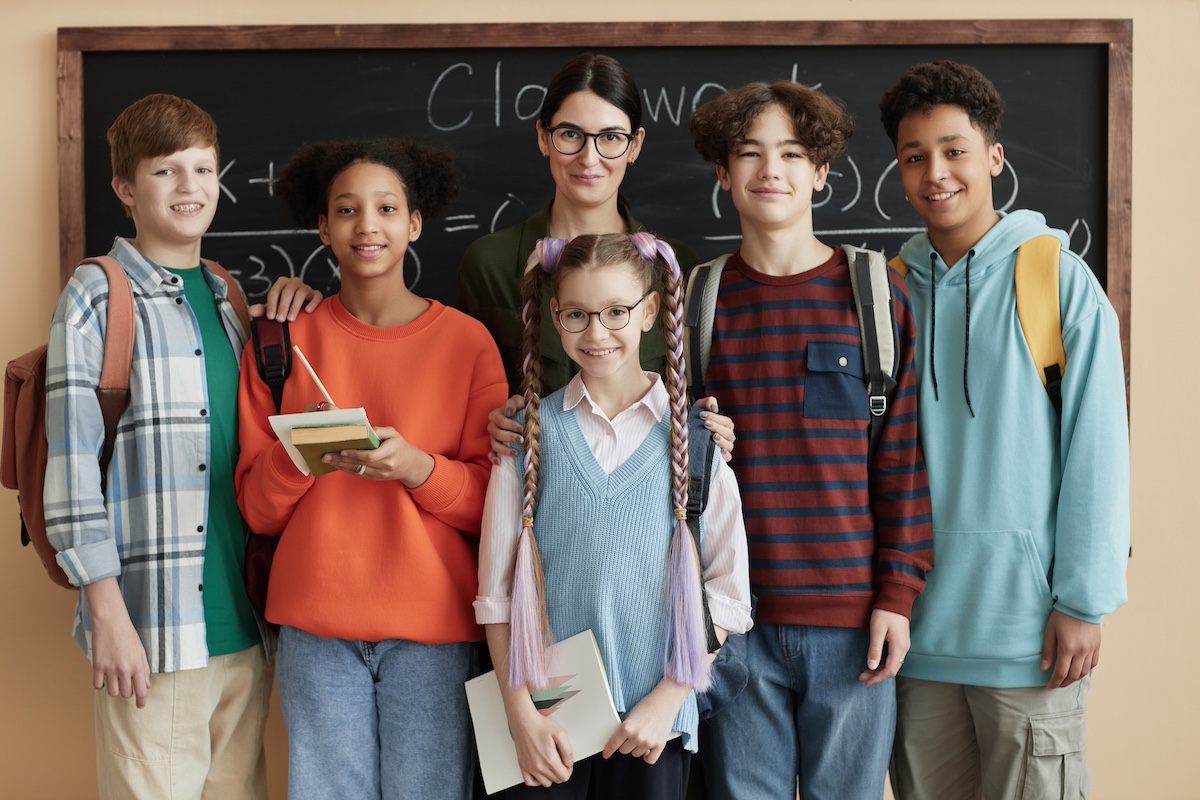 Kids in front of a chalkboard