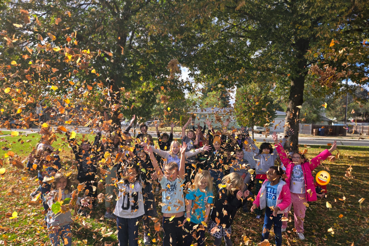 kids playing in leaves
