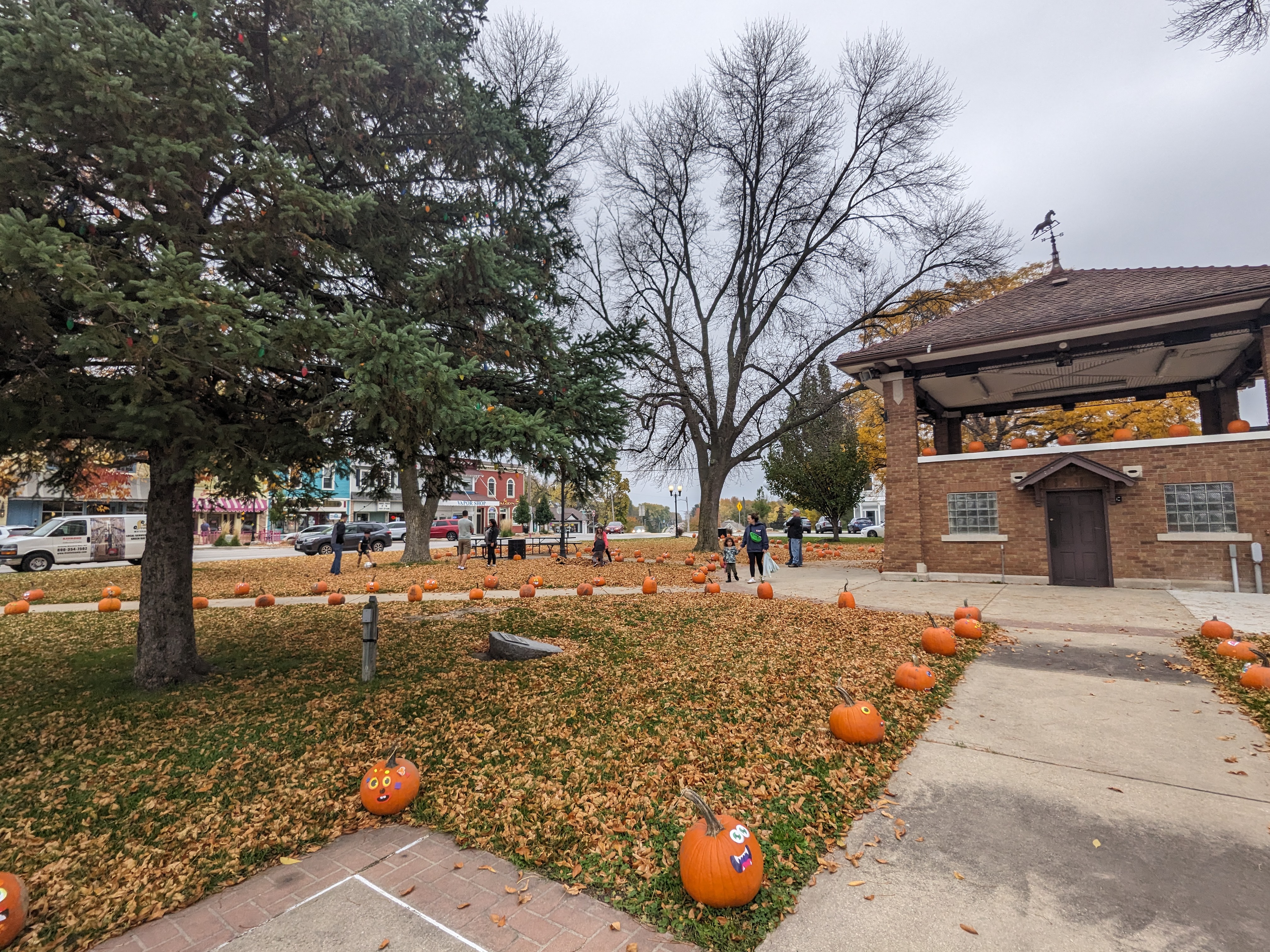 Pumpkins lining the walkway at a park