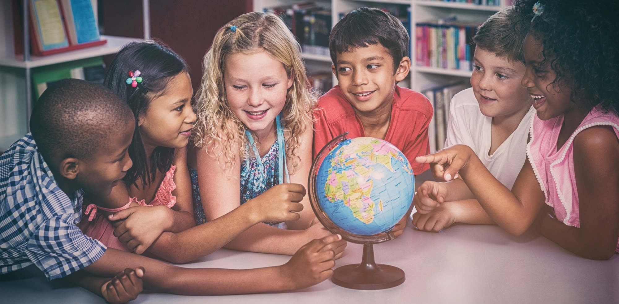 Kids playing with globe