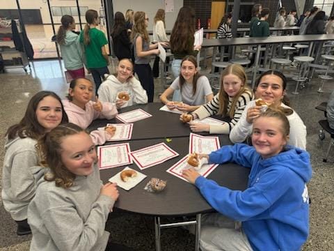 Ladies eating donuts