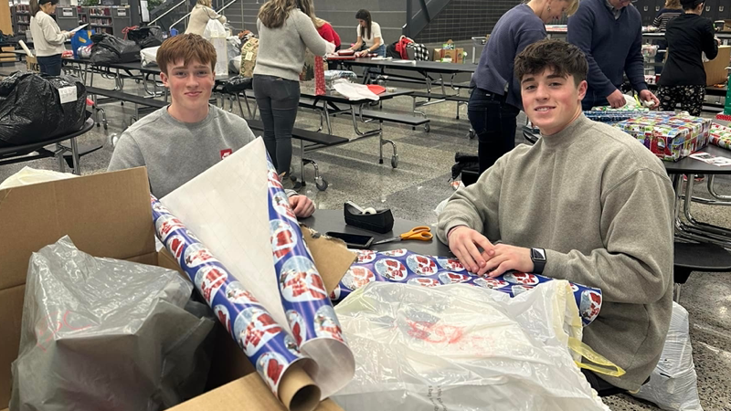 Kids wrapping gifts